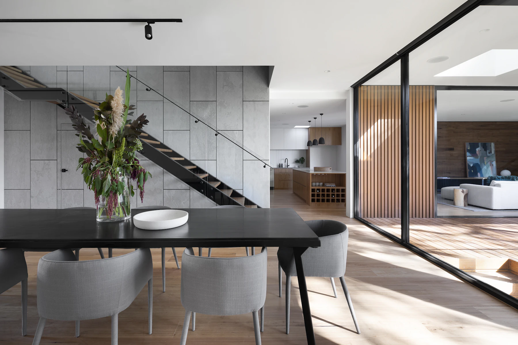 Measured daylight crossing a restrained contemporary interior